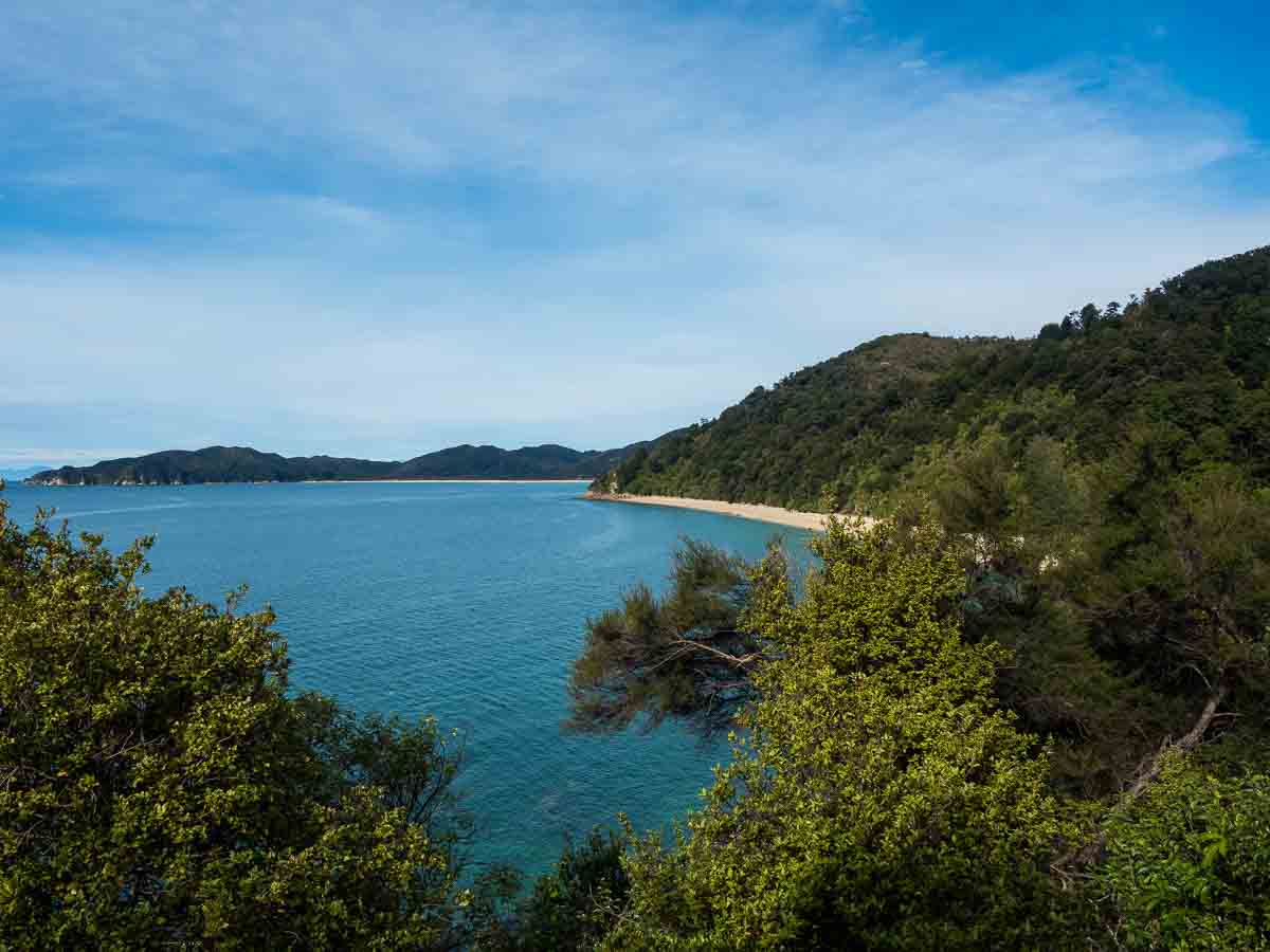 Blue water and forested headlands on the Abel Tasman Coast Track