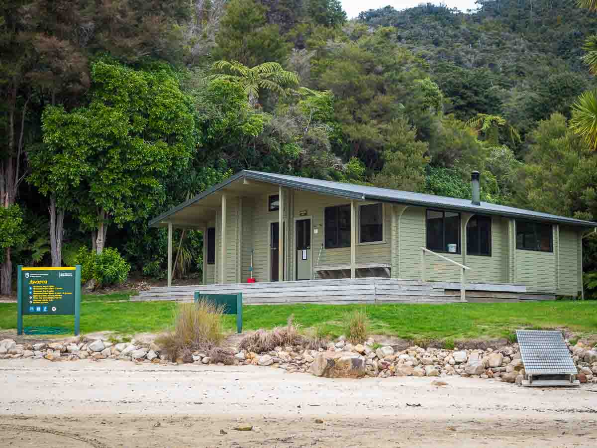 DOC hut beside a beach on the Abel Tasman Coast Track