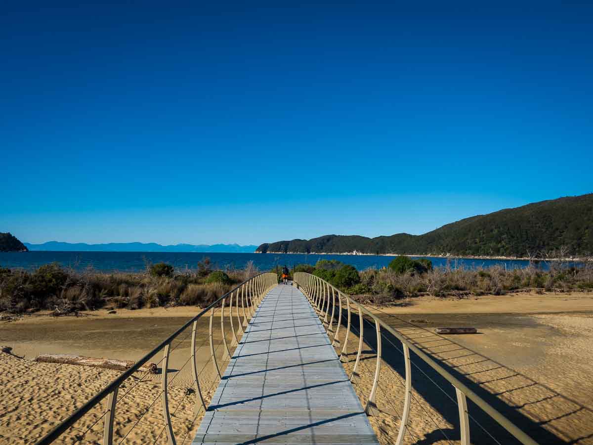 Boardwalk crossing a tidal estuary on the Abel Tasman Coast Track