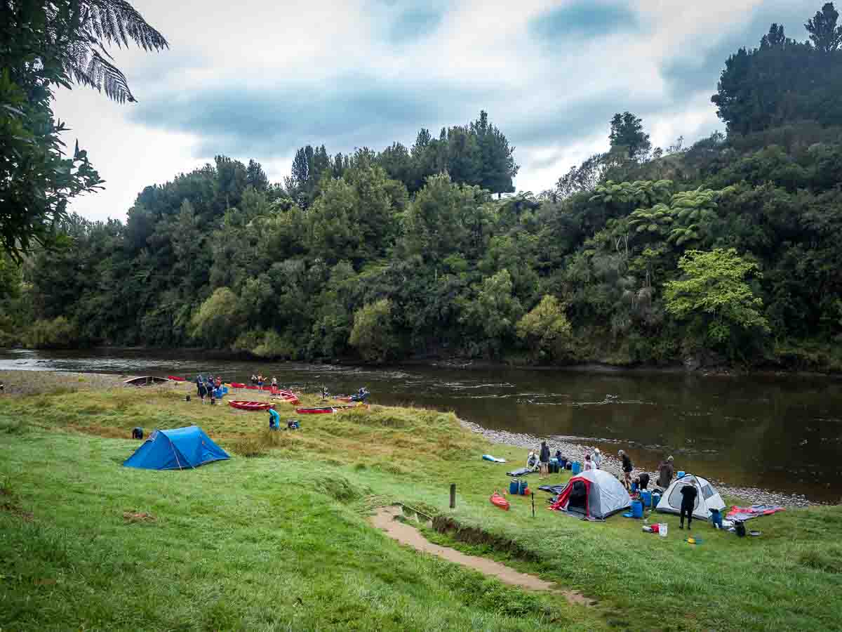 Small tents pitched beside the Whanganui River