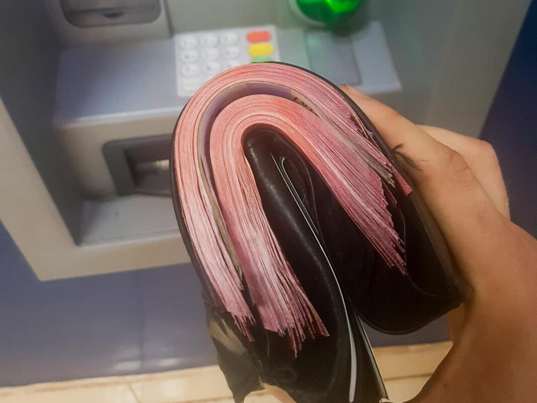 Tristan Balme A wallet full of cash to pay the kili tour company