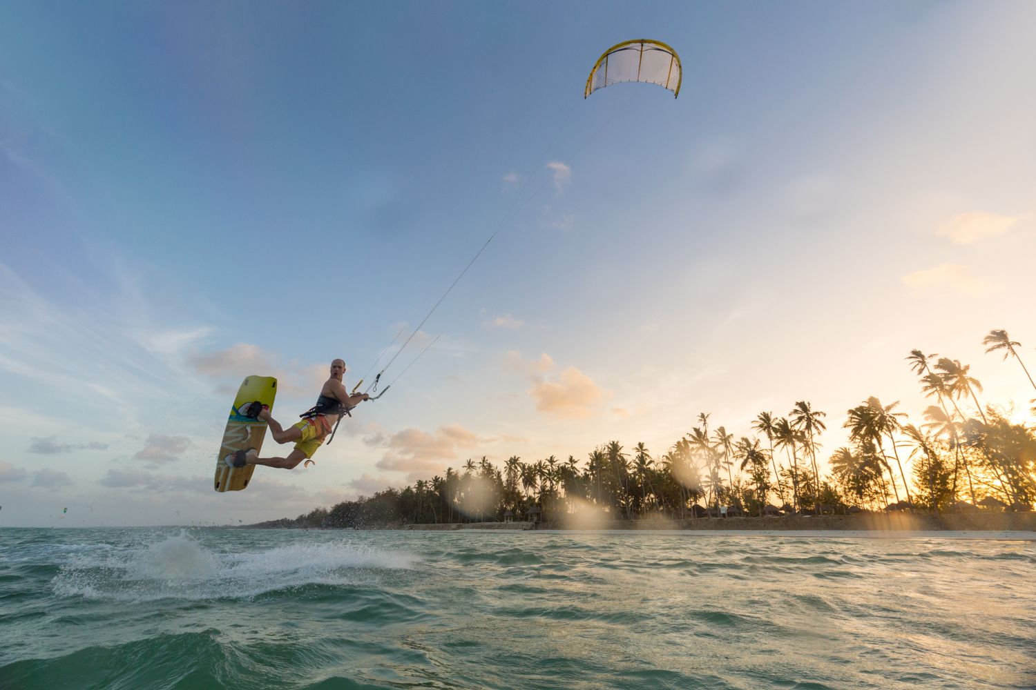 Kitesurfers riding the shallow lagoon at Paje Beach Zanzibar