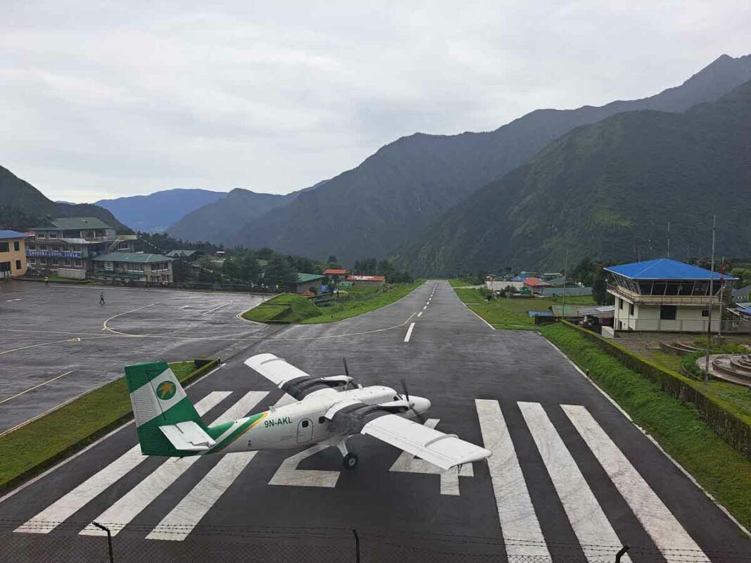 a plane landing in lukla airport where you start the everest base camp trek
