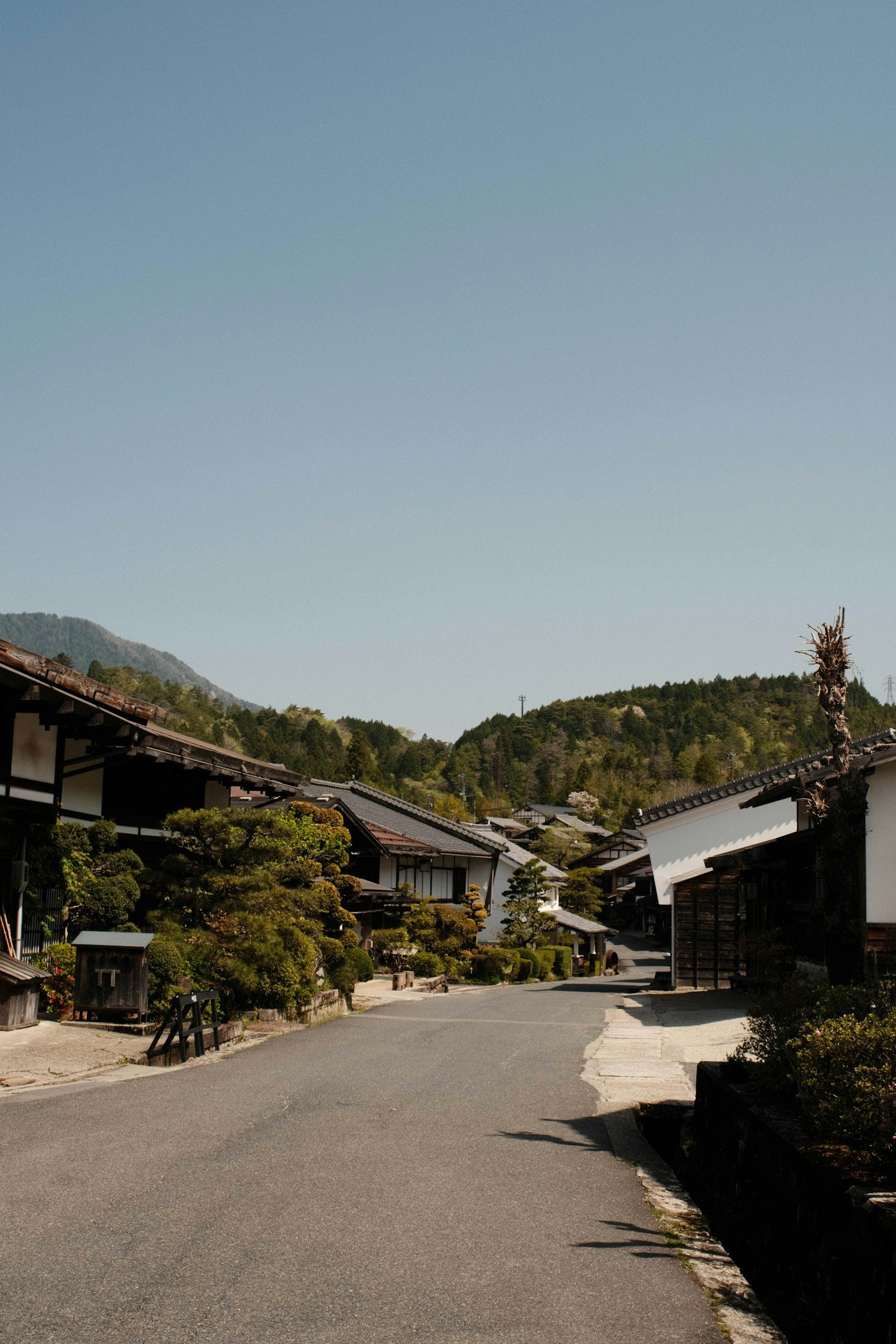 Traditional wooden buildings on the Nakasendo Way through Tsumago-juku in Japan