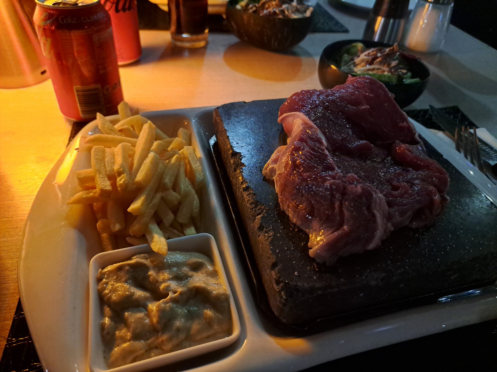 Steak cooking on a hot stone at Stonegrill in Port Vila Vanuatu