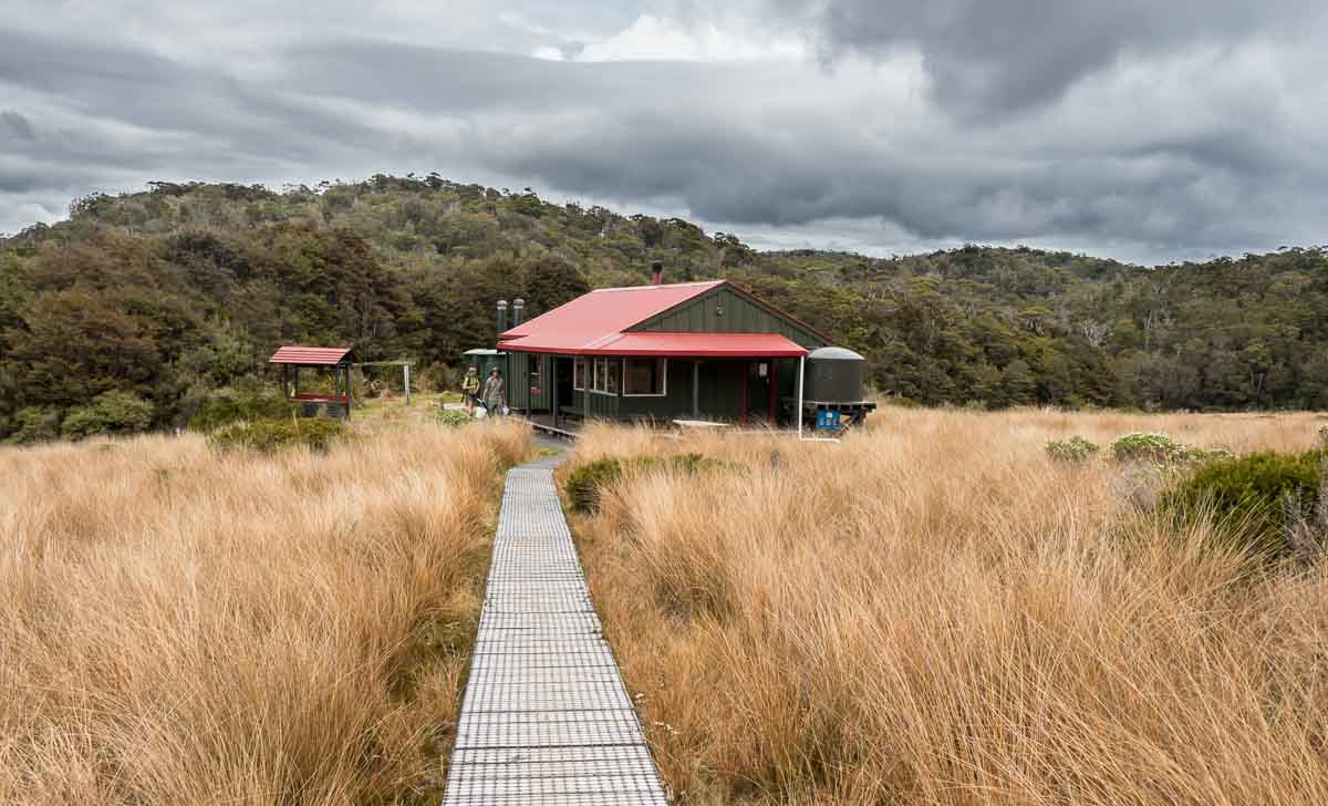 Gouland Downs Hut beneath heavy clouds on the Heaphy Track